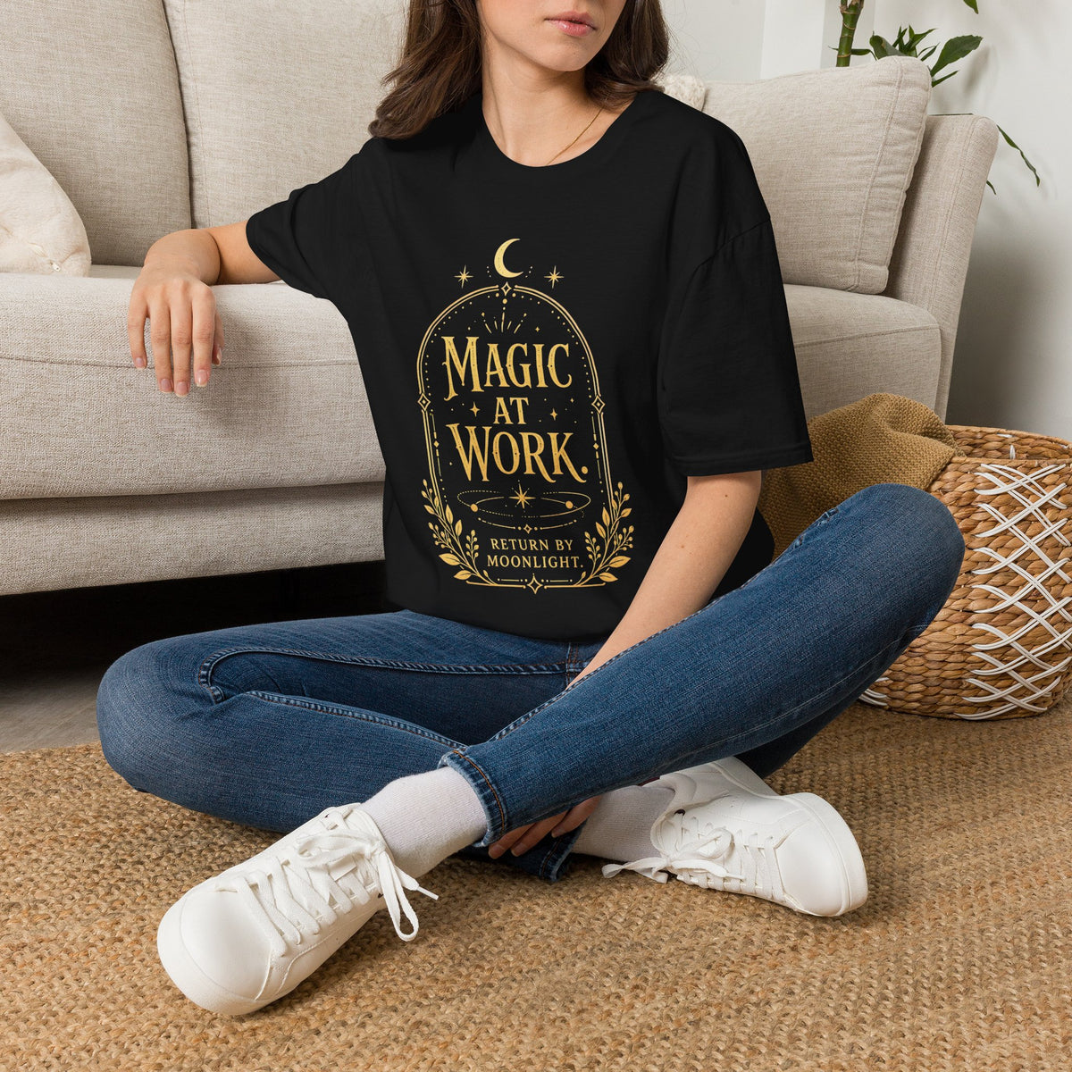 Antique-gold crescent moon artwork on the Magic at Work T-shirt