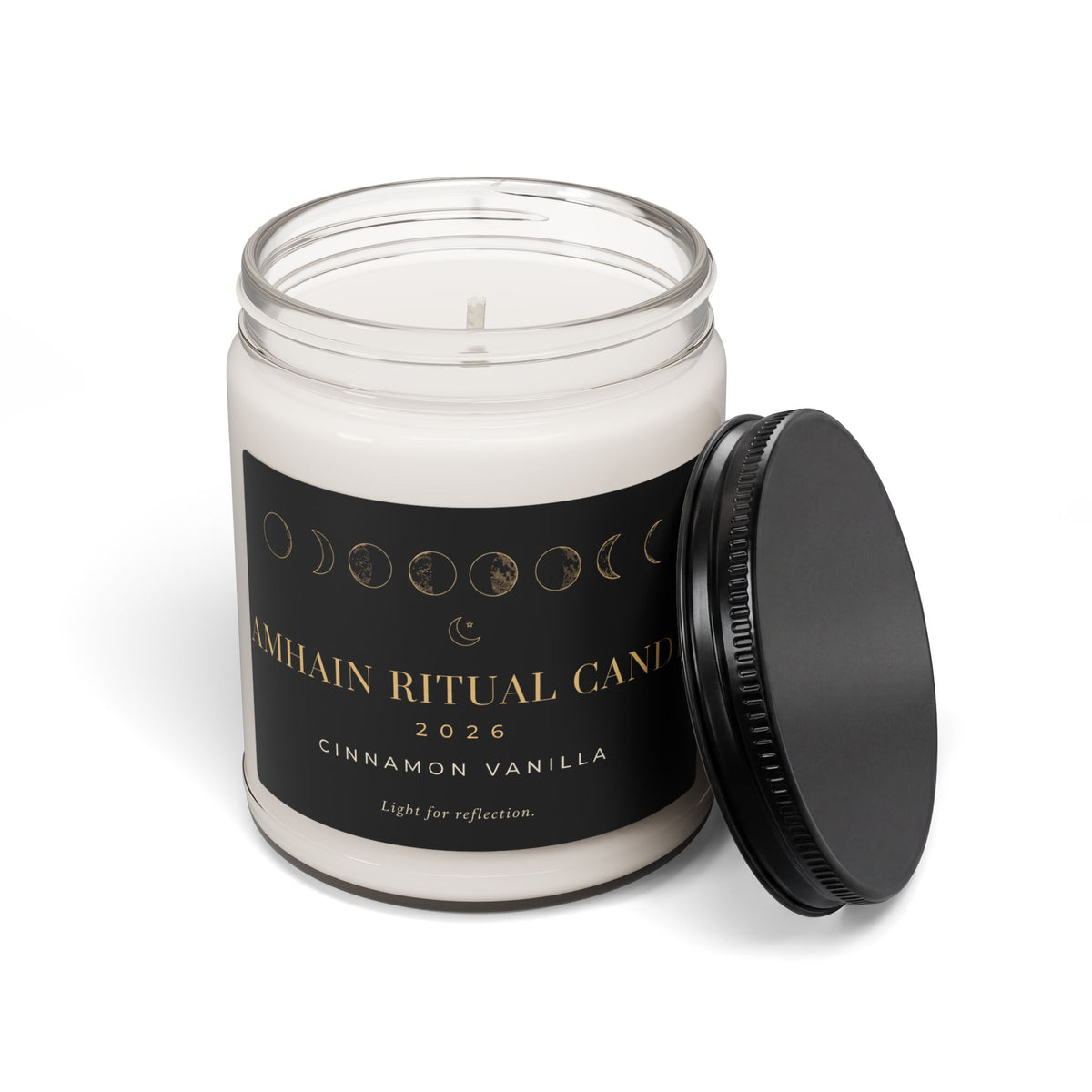 Open Cinnamon Vanilla Samhain Ritual Candle with black lid beside the moon phase glass jar