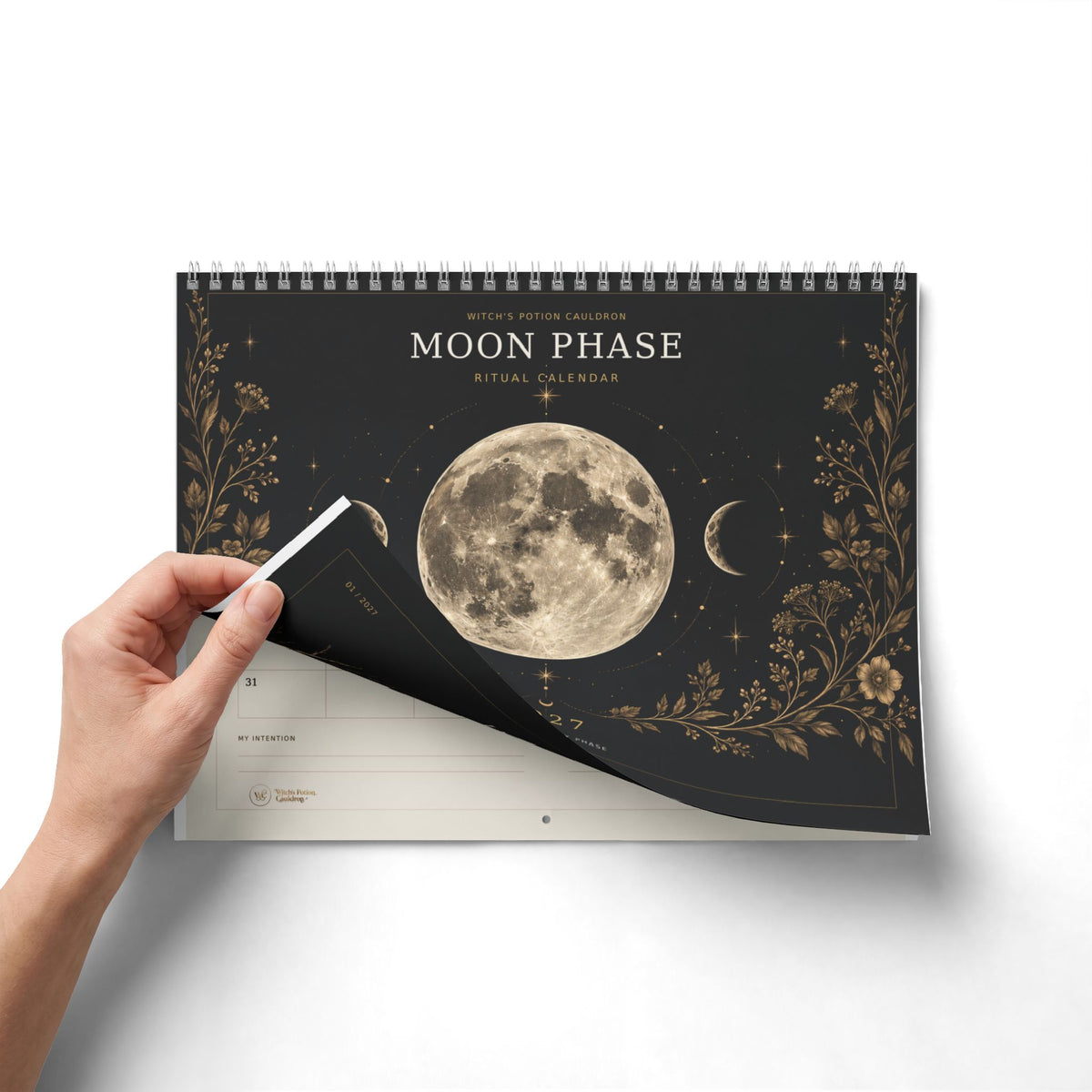 Close view of the Moon Phase Ritual Calendar binding and printed pages