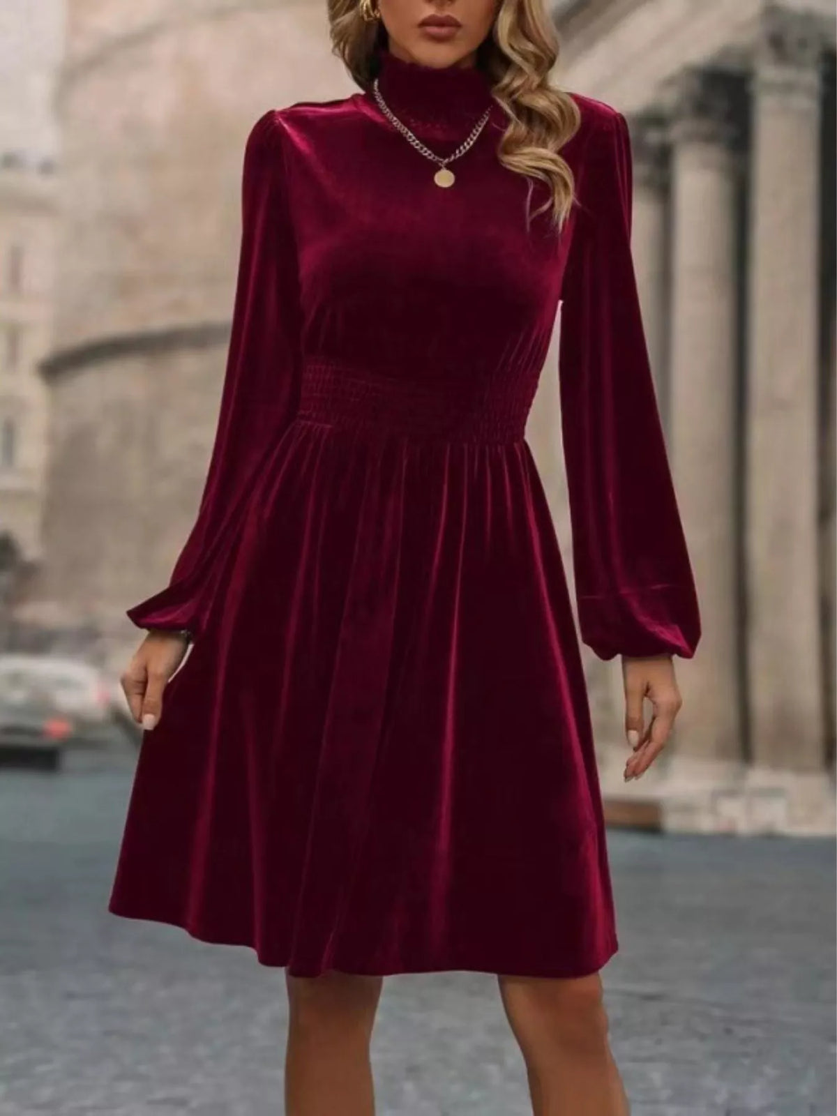 Burgundy velvet high-neck dress with long sleeves and A-line skirt