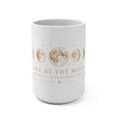 White 15 oz Live by the Moon mug with gold moon phase artwork