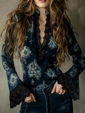Midnight floral blouse with black lace trim and flared sleeves